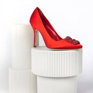 Manolo Blahnik Red satin pumps featuring square buckle with red crystals,
